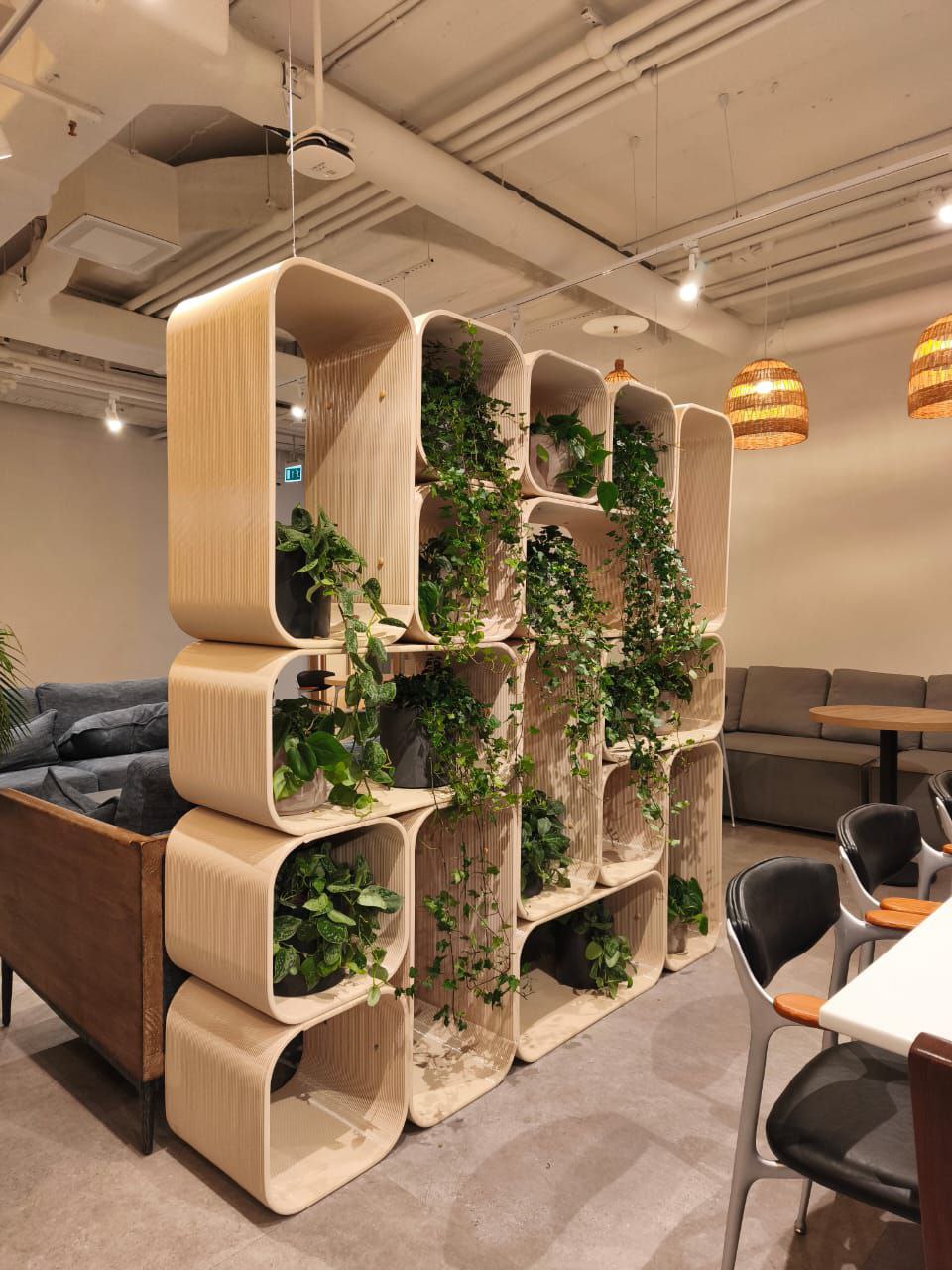 Large-format 3D-printed shelving with plants